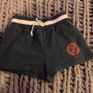 Navy and white Nike sweat shorts.